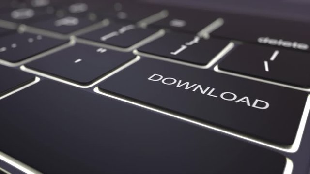 Tracking shot of modern black computer keyboard and luminous download key. Conceptual 4K clip