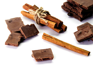 milk chocolate with cinnamon, raisins on white background