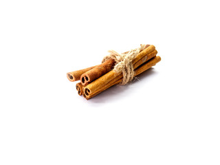 cinnamon sticks in a bundle on white isolated background