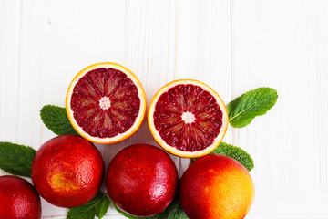 Lemon,red orange, orange, grapefruit,  lime, tangerine on old wooden table. Place for text. Background.