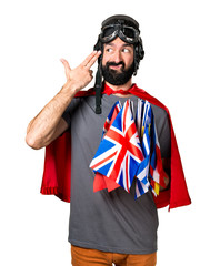 Superhero with a lot of flags making suicide gesture