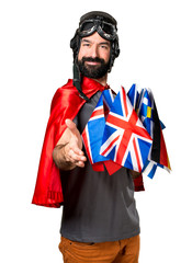 Fototapeta premium Superhero with a lot of flags making a deal