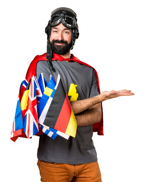 Superhero with a lot of flags presenting something