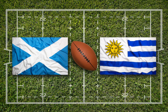 Scotland vs. Uruguay flags on rugby field