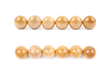 Line of six wooden spheres isolated