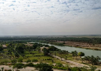 Tuinposter View to Euphrates river from former Saddam Hussein palace, Hillah, Babyl, Iraq © homocosmicos