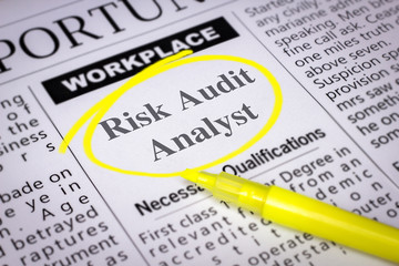 Obraz premium Risk Audit Analyst - Newspaper sheet with ads and job search, circled with yellow marker, Blurred image and selective focus