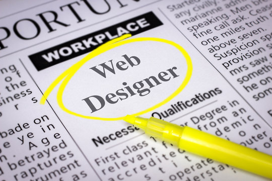 Web Designer - Newspaper sheet with ads and job search, circled with yellow marker, Blurred image and selective focus