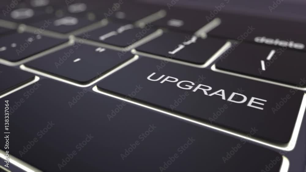 Poster tracking shot of modern black computer keyboard and luminous upgrade key. conceptual 4k clip