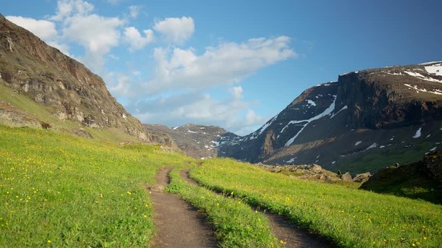 On the way up to Trollsjön (Rissajaure) in northern Sweden, you find this idyllic mountain landscape with a small road. Close to Kiruna / Abisko and the border to Norway. Timelapse, July 11 2016.
