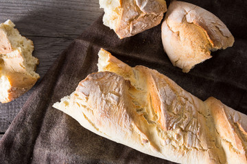 Homemade baguettes on wooden table