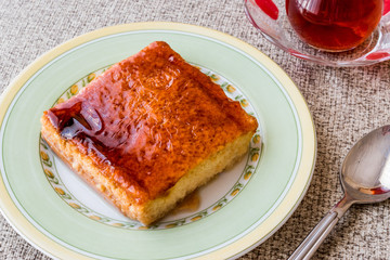Balkan Dessert Cake Trilece with caramel sauce and tea.