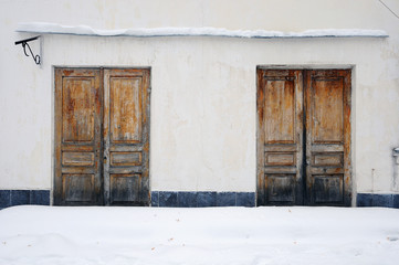 Two old wooden doors of the old building. 