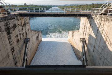 Water pouring through the water gates at dam