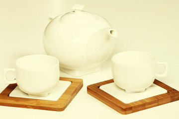 White cup and teapot fot tea or coffee