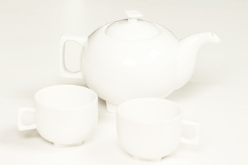 White cup and teapot fot tea or coffee