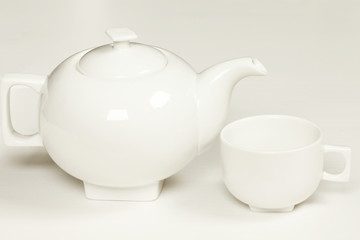 White cup and teapot fot tea or coffee