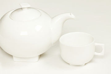 White cup and teapot fot tea or coffee