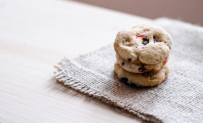 Three healthy homemade cookies on jute pad