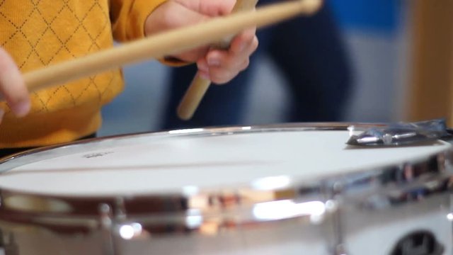 Teen drummer playing in school