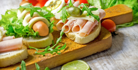 Sandwich with ham and sandwich with hot dog-frankfurter on table close up