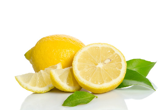 Lemon and half with leaves  isolated on white background