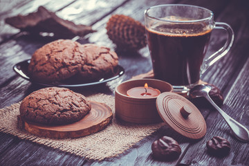 Homemade chocolate cookies on wooden black table background.