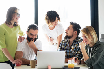 International students are generating ideas for the diploma project at the university office. Group of young freelancers is discussing new business ideas during online meeting with the customers.