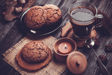 Homemade chocolate cookies on wooden black table background.