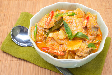 spicy bamboo shoot with chicken in coconut cream and red curry 
