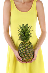 Woman holding pineapple on white background