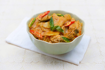 spicy bamboo shoot with chicken in coconut cream and red curry 
