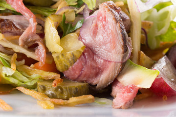 close up of warm meat salad