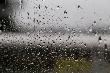 outside the rain, outside the city. Drops of rain on the window