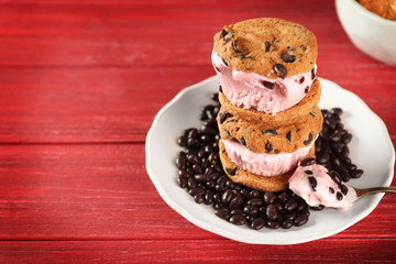 Delicious cookies with ice cream and chocolate chips on plate