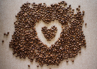 A Heart Shape Made Of Coffee Beans On The Textile Background