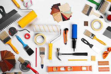 Color swatches and painting tools all around on table