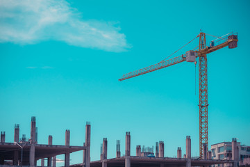  crane and blue sky in background.