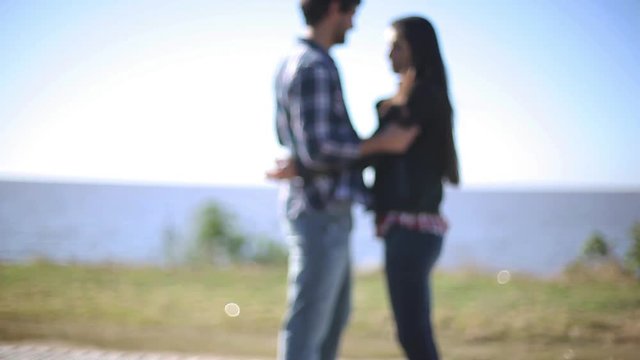 Couple embracing on seaside bluff
