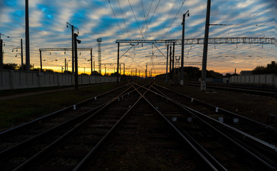 Fototapeta na wymiar Railroad tracks at sunset.