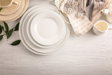 White dishes on wooden table