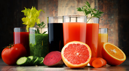 Fototapeta premium Glasses with fresh organic vegetable and fruit juices