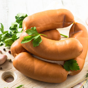 Uncooked sausages with vegetables