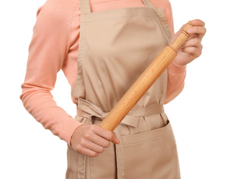 Young woman in apron with rolling pin, closeup
