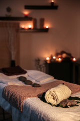 Interior of modern massage room in candle light
