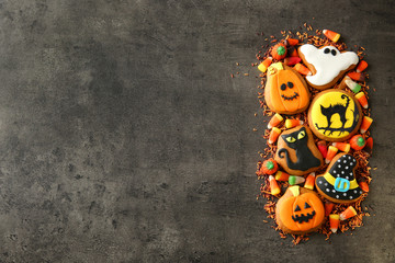 Fototapeta premium Halloween cookies and jelly sweets on dark background