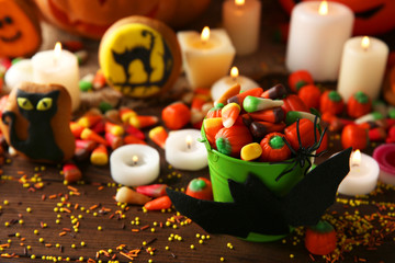 Halloween jelly sweets in bucket on wooden table