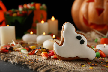 Halloween cookie and jelly sweets on sackcloth