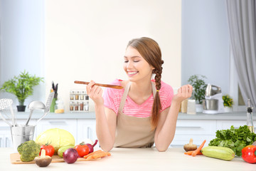 Young woman cooking at home