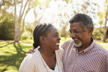 Obraz premium Outdoor Head And Shoulders Shot Of Mature Couple In Park
